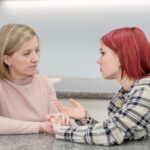 Mom talking to teenage daughter.